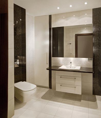 Łazienka czarno-biała, widok umywalki i wbudowanej w ścianę szafki
